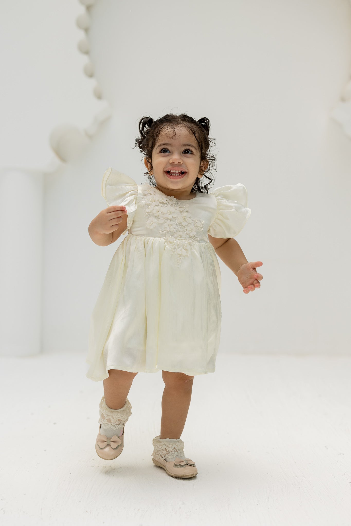 Ivory Blossom Baby Dress with Floral Embellishments