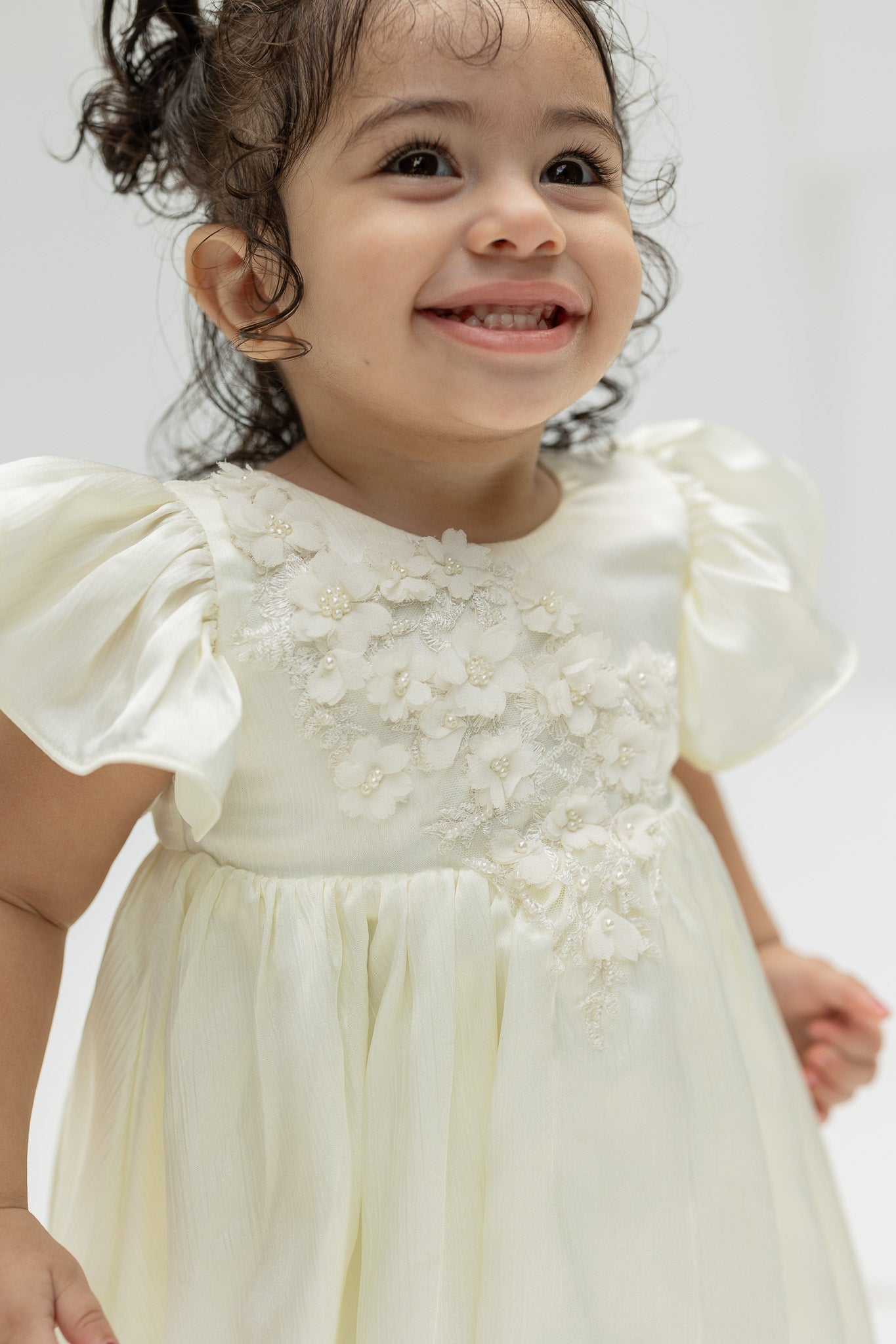 Ivory Blossom Baby Dress with Floral Embellishments