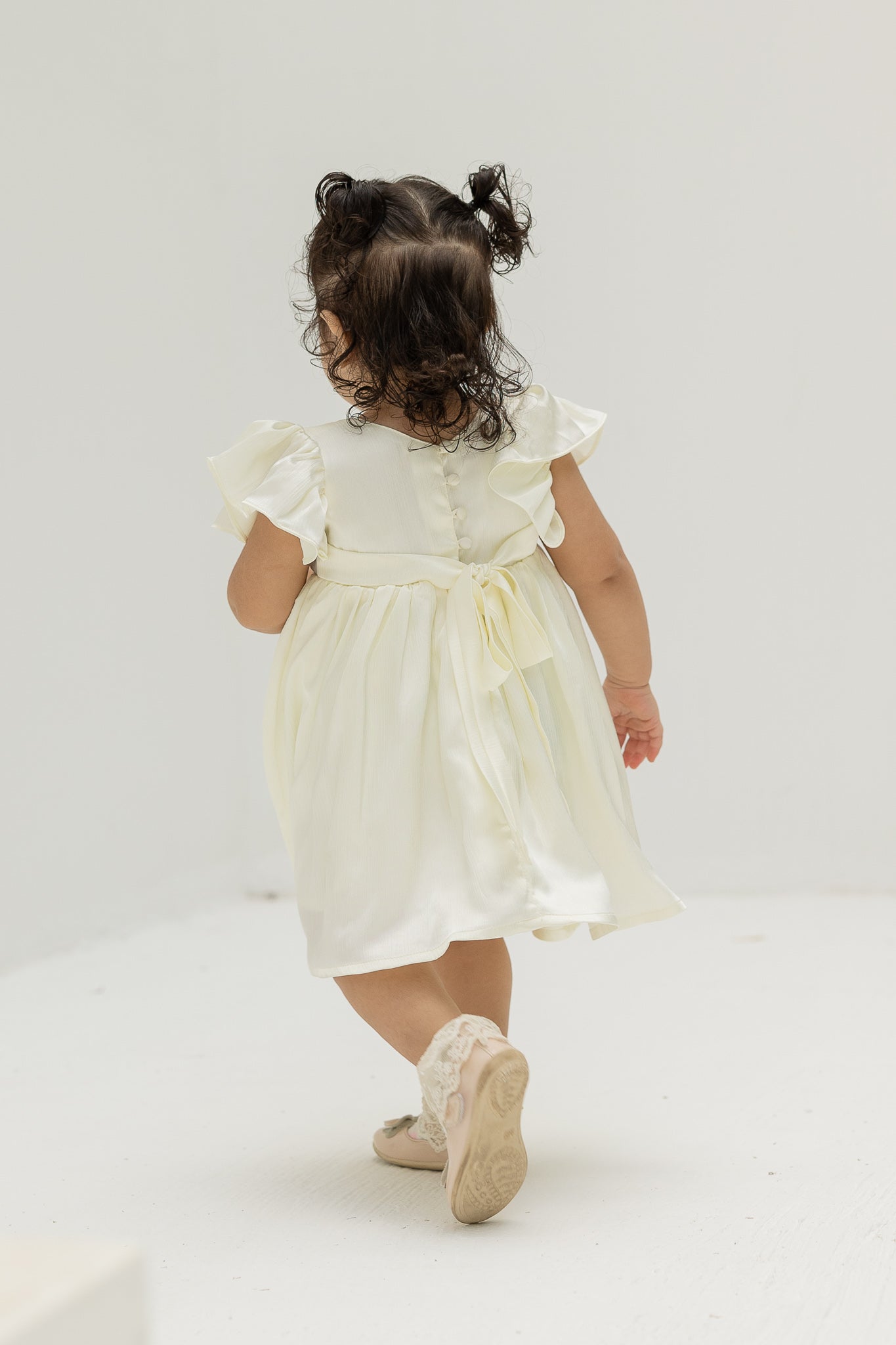 Ivory Blossom Baby Dress with Floral Embellishments